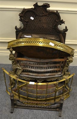 Lot 1183 - A cast iron fire grate together with a cast iron punch door stop