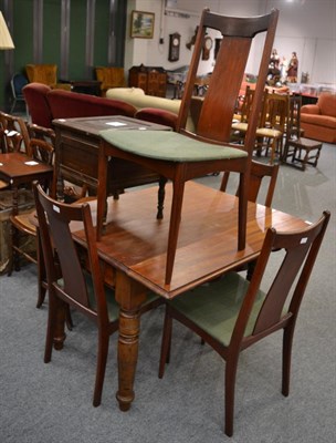 Lot 1187 - A dining table and four chairs