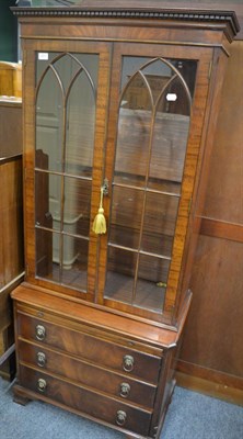 Lot 1201 - A Bevan & Funnell reproduction mahogany bookcase cabinet