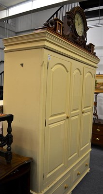 Lot 1207 - A painted pine cupboard with clock pediment&nbsp