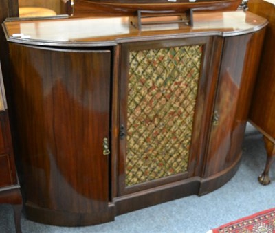 Lot 1211 - A bow fronted cabinet with central grille door