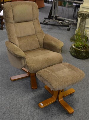 Lot 1214 - A GFA swivel reclining armchair and footstool