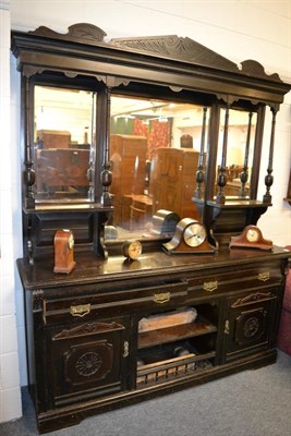 Lot 1224 - A large late Victorian ebonised sideboard, mirrored back, the base with drawers, cupboards and...