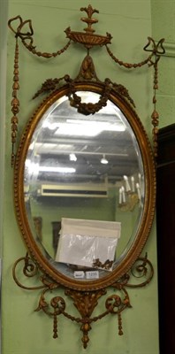 Lot 1235 - A mid 19th century gesso wall mirror with urn and ribbon tied swag pediment