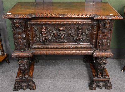 Lot 1236 - A 19th century oak chest on stand decorated with lion masks, putti and caryatids, the stand...