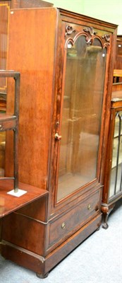 Lot 1255 - A 19th century flame mahogany glazed bookcase, fitted with a base drawer