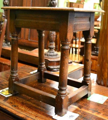 Lot 1259 - An oak joint stool