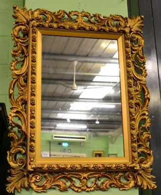 Lot 1260 - A reproduction gilt framed wall mirror