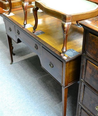 Lot 1262 - A reproduction leather inset mahogany writing desk