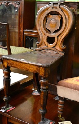 Lot 1267 - A Victorian oak, shield back plank seated chair