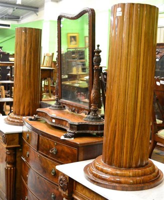 Lot 1268 - A pair of walnut uniformly gadrooned cylindrical pedestals on stepped bases