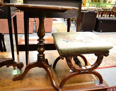 Lot 1275 - A needlework stool on a carved mahogany frame together with a tilt top occasional table