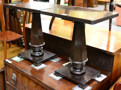 Lot 1277 - A pair of rosewood occasional tables each with tapering, faceted uprights