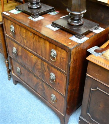 Lot 1278 - A part ebonised mahogany three height chest of drawers, with later added ring, lion and mask...