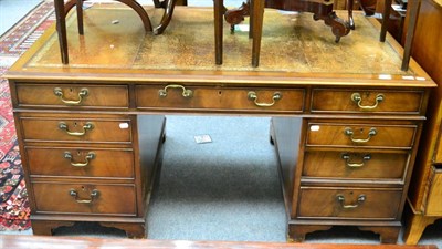 Lot 1287 - A leather inset pedestal desk