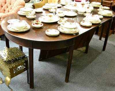 Lot 1298 - A George III D end mahogany dining table