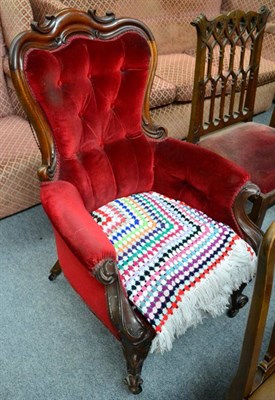 Lot 1303 - A Victorian carved mahogany framed button back armchair