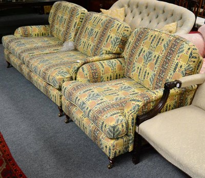 Lot 1312 - A feather filled two piece suite comprising a sofa and an armchair