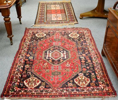 Lot 1326 - Kashgai Rug, South West Iran, the raspberry field centred by an octagon enclosed by narrow...