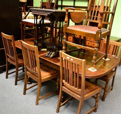 Lot 1331 - An oak extending dining table together with a set of six chairs including one carver (a.f.)