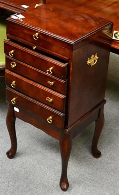 Lot 1335 - A Victorian mahogany wind out dining table raised on boldly reeded legs, together with a modern...