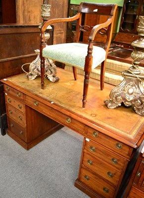 Lot 1340 - A large Victorian mahogany twin pedestal desk with original tooled leather top with a single carver