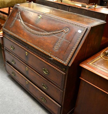 Lot 1342 - A 19th century carved oak bureau