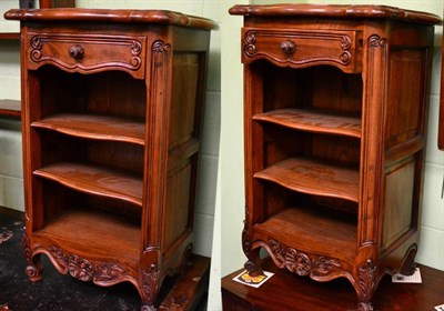 Lot 1346 - A pair of reproduction carved hardwood cabinets with oak lined drawers