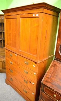 Lot 1350 - A Victorian pitch pine linen press, the cupboard top with three drawers and four further drawers to