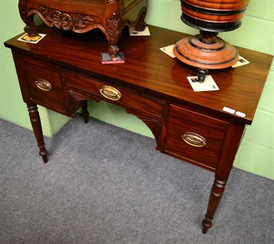 Lot 1353 - A mahogany kneehole desk of small proportions