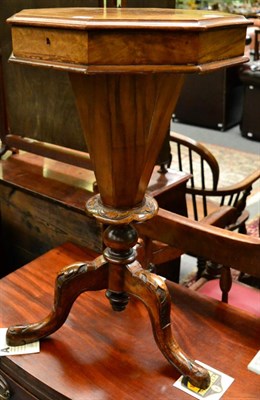 Lot 1355 - A Victorian walnut octagonal sewing table, with hinged cover, on tripod supports