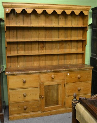 Lot 1361 - A pine dresser and rack