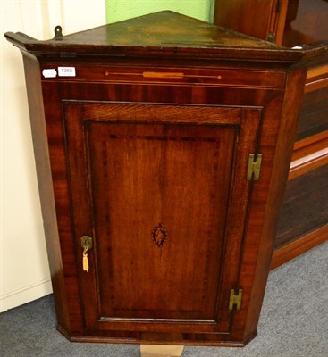 Lot 1365 - A George III inlaid mahogany corner cupboard