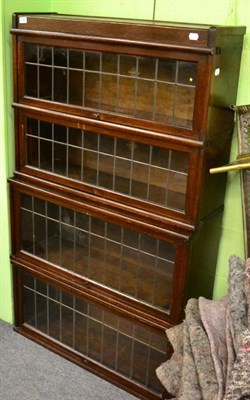 Lot 1366 - A globe-wernike oak four tier sectional bookcase