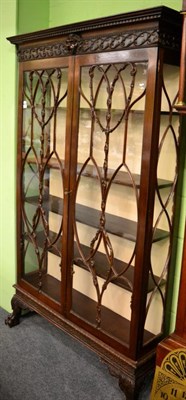 Lot 1370 - A good carved mahogany display cabinet, circa 1900, with glazed doors and carved claw feet&nbsp