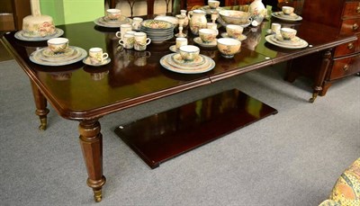 Lot 1371 - A mahogany extending dining table fitted with three leaves