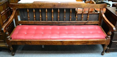 Lot 1372 - A 19th century settle with turned uprights