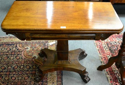 Lot 1383 - An early Victorian mahogany fold over table on pedestal support