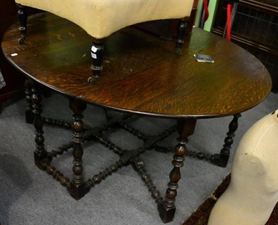 Lot 1385 - A 17th century and later oak gateleg table, with heavily turned legs and stretcher