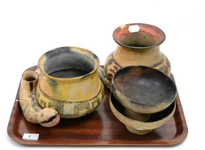 Lot 4 - Five pre Columbian style pottery items, to include a Nazca style snake, two pots and two footed...
