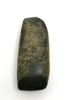 Lot 25 - An ancient Neolithic period carved green stone axe or celt, found in Western China, of typical...