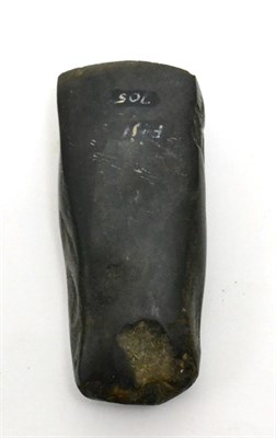Lot 26 - An ancient carved black stone axe or celt, Fiji, circa 500BCE-500 A.D. of polished surface and...