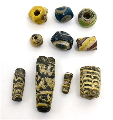 Lot 34 - A collection of ten Egyptian core-formed glass beads, Ptolemaic -Roman period, 4th century...