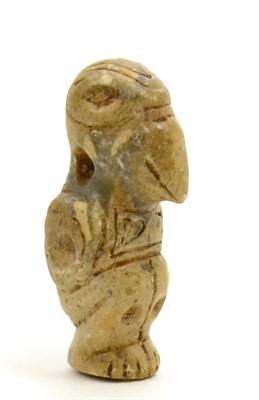 Lot 39 - A Taino carved stone bird shamen, circa 1000-1500 AD, carved in the round with geometric decoration