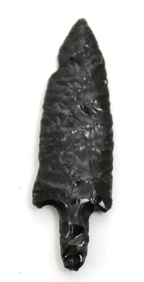 Lot 45 - A Pre Columbian Toltec carved obsidian stemmed dart or lanceolate spearhead, circa 950-1150 AD,...