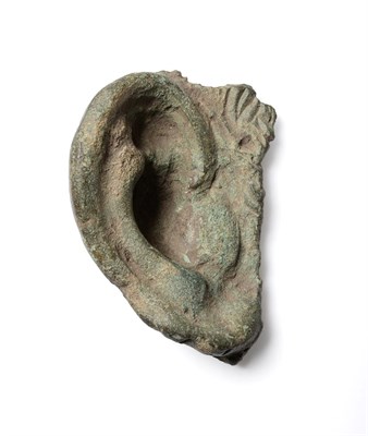 Lot 59 - A Roman cast bronze ear from a life-size head or statue, circa 200 AD-400 AD, anatomically...