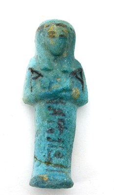 Lot 67 - An Egyptian bi colour blue faience ushabti, XXI-XXII dynasty, circa 500 BCE-1000BCE, decorated with