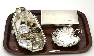 Lot 70 - A silver cigarette box, inkstand, leaf dish, napkin ring, thimble and three plated napkin rings