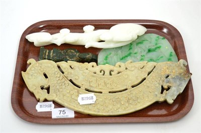 Lot 75 - A large Chinese jade huang; a large oval plaque flecked with green; a Chinese white stone ruyi...