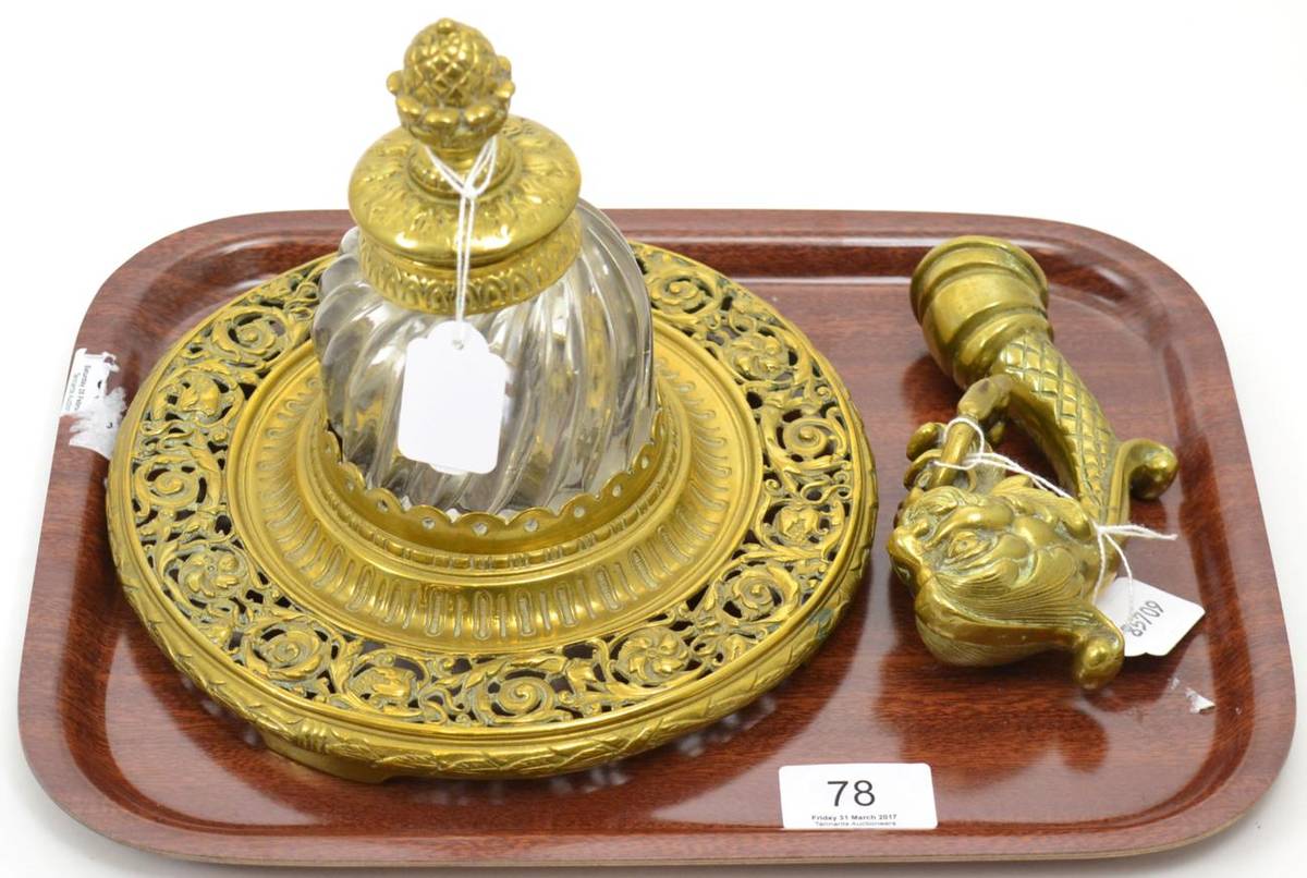 Lot 78 - A late 19th century pierced brass inkwell with glass inkwell and a stylish gondola mount (2)